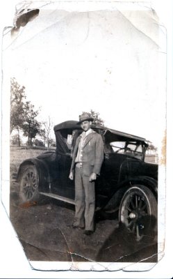 Jackie's Dad in front of a car