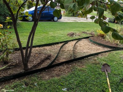 Here is the curved path outline and outer edging installed before putting any soil additives.