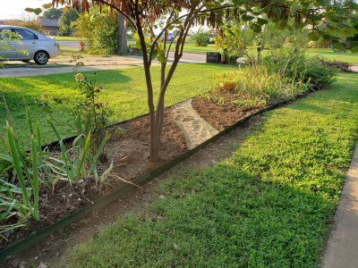 Bed and path borders installed with materials added