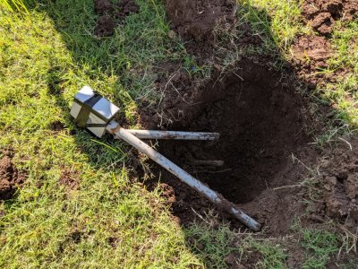 This is the old middle-of-the-yard outlet. Since the power was no longer connected to it, it was dug up and removed, allowing me to mow with one less impediment.