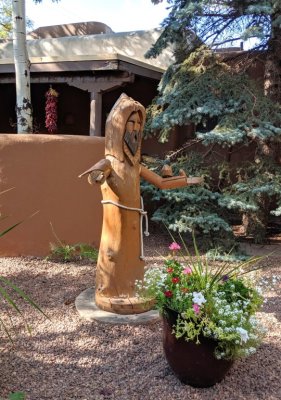 Back at our hotel, we found this carved tree trunk of St Francis in the interior garden.