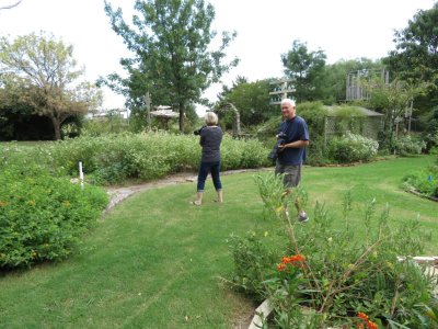Jan and Steve, chasing butterflies around the flower beds