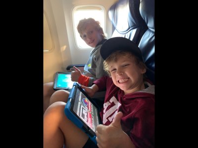 Pierce and Max on their flight to OKC on Wednesday morning before Thanksgiving