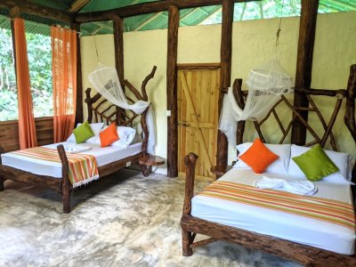 Our sleeping area was elegantly decorated with branches for bed posts and head boards and slices of big trees for night stands.