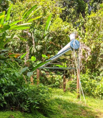 The passive solar water heater behind our cabin