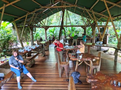 Mary, with her voice recorder; Ann, Carolyn and Monica sitting in the far left corner; Jody and Deb, talking at the bar; and Tom and Fran, at another table; all waiting our last lunch at Danta Corcovado Lodge.