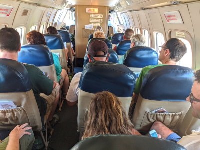This was a turbo-prop plane and a little bigger than the one we flew down in, so there were several more passengers than just our group: Derek and Deb (on the left), Fran and Tom (four rows up), then Leigh, Chito and Jody.