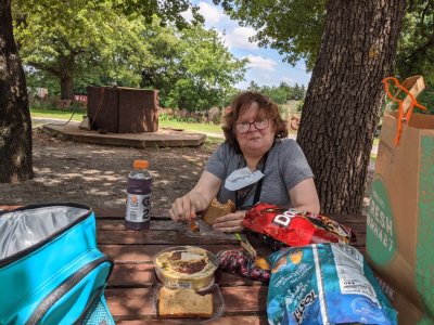 We found a table in the shade near the closed gift shop at The Holy City and ate our packed lunch while watching a pair of Eastern Phoebes taking insects to their nest in the eave of the building.