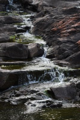 Water running down the rocks from the spillway