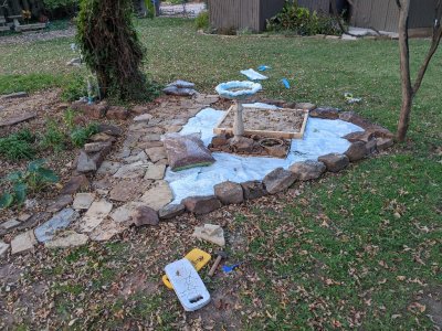 I used empty potting mix bags to cover the ground before putting down the cypress mulch.