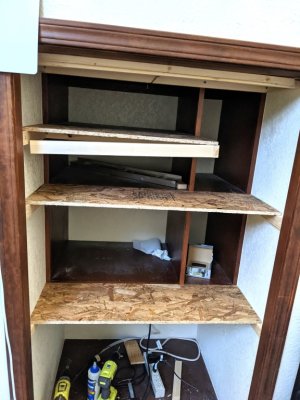 By Friday I had decided how I would install the rest of the shelf supports and the 2x4 stud supports for the TV mount, so went to work again. I cut the remaining shelves and tested their fit. 