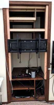I tried the fit of the supports that attach to the TV; the pieces with loops on the ends are the pull releases for the brackets that allow you to remove the TV from the wall mount.