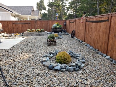 They did away with the need for a lawnmower by putting river rocks everywhere in the yard, as well as many rocks that Pepper and his friend Steve Getz loaded up from their place in Powers and brought to the coast.