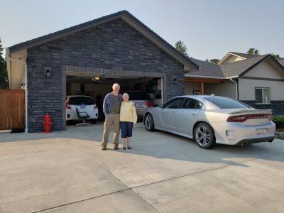 Steve and Jackie, in front of the garage and our rental car.
We ordered a Toyota Corolla but got a Dodge Charger with a 'hemi' engine that peeled out noisily at a touch of the gas pedal.