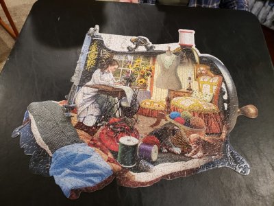 It's a 'shape' puzzle, a picture of a woman working at an old-style sewing machine, the puzzle itself in the shape of a sewing machine.