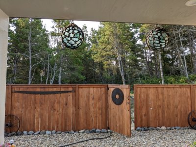 The back gate. Note the two large fishing floats, part of Pepper's collection.
