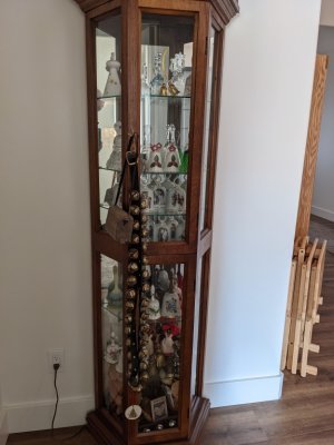 A display case with some of Kathy's ceramic bells