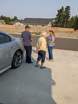 Pepper and Jackie, talking to one of their many neighbors who stop by on their walks.