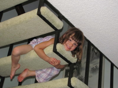 Corrina climbing around on the stairs