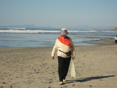 Mom walking along the shore