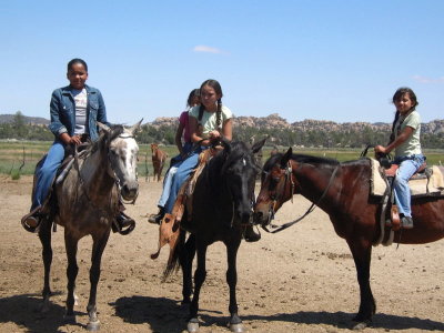 Cousins on horses