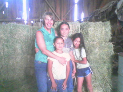 Jeanette and the girls in the barn July 2006