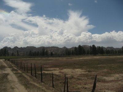 Clouds over the ranch - see the prism of colors in the clouds?