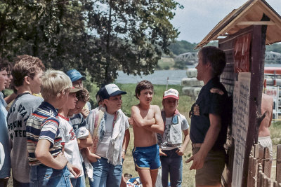 Instructions from scout camp counselor before canoe lesson