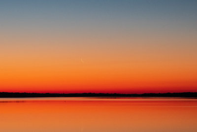Thin moon over the Bay of Quinte before sunrise