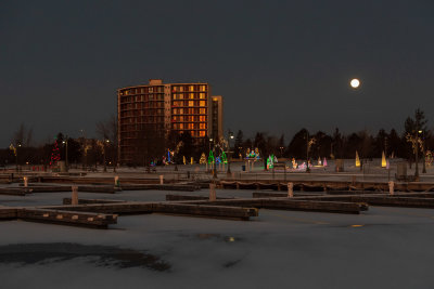 Full moon over Christmas decorations in Jane Forrester Park