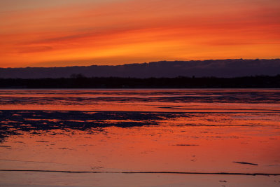 Purple and orange skies reflected in the Bay of Quinte