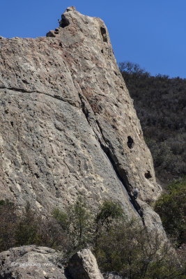 Two hikers scaling the face of one of  the Castle Rocks 