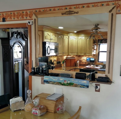 Added a mirror to Kitchen wall