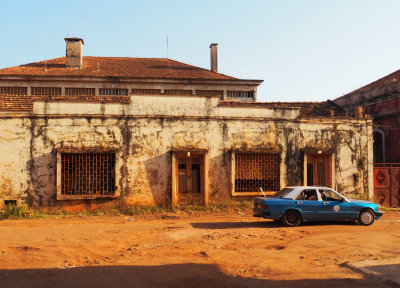 Abandoned building and old taxi, Bissau