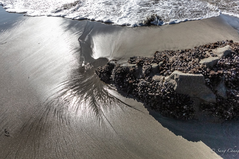 sea wave,s marks in the sand