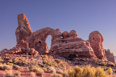 an arch at sunset