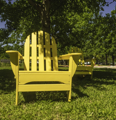 A close-up of  Adirondack lawn chairs,