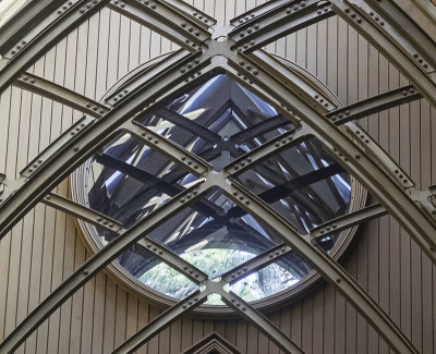 A closer look of Detail of round window over front door inside the chapel.