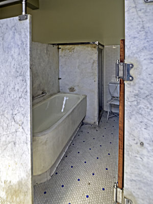 Typical men's bath room off the main bath hall
