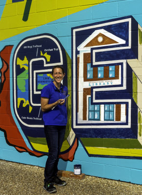 The artist, Sarah Blankenship, who designed this mural.