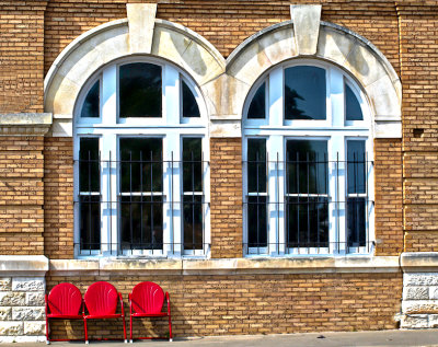 Two windows and three chairs