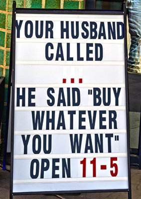 Sign seen outside a woman's clothing store (3/19)