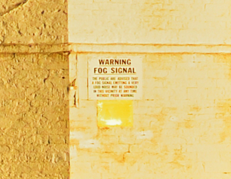 Lighthouse warning sign. 200% crop from original image.