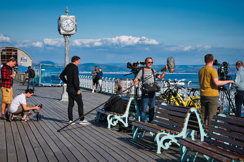 TV crew filming on the pier.
