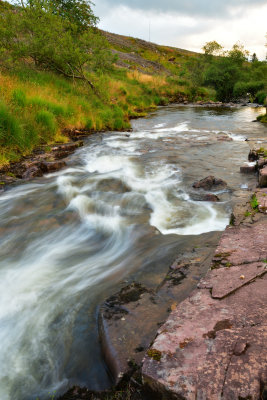 Rushing downhill.