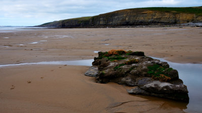 Lone rock near low water mark.