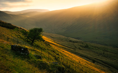 Setting sun behind Yr Allt.
