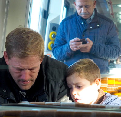 Father & Son Reading on Tube, London Dec. 2019 P1010033.JPG