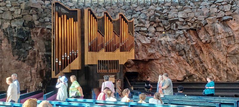 The conductor & acoustical engineer gave insight & they could fulfill all the requirements by leaving the rock walls exposed