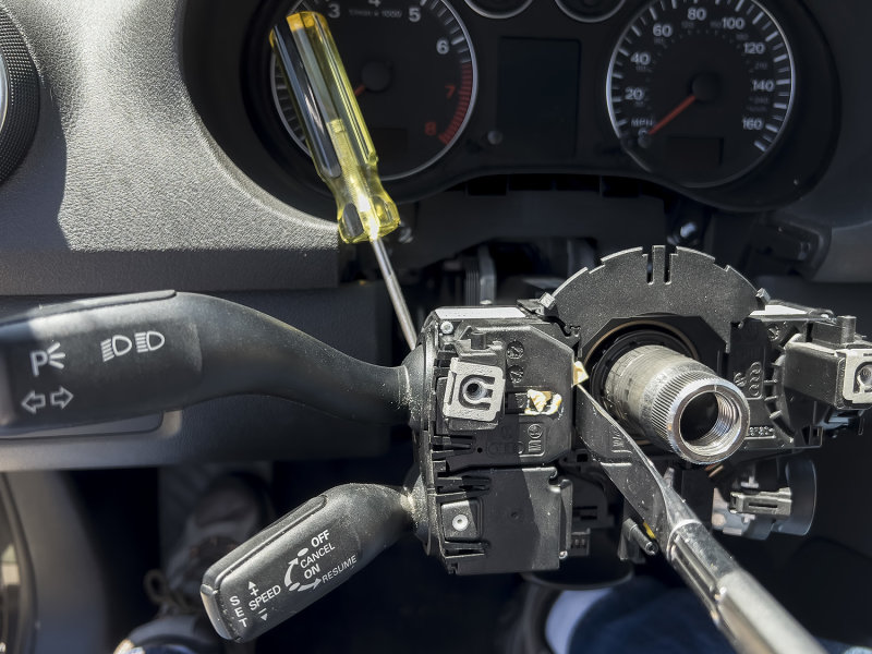 Removing the Turn Signal and Cruise Control levers using a screw driver and butter knife